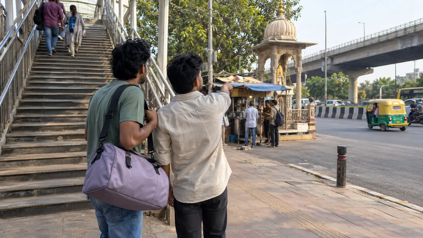 Travellers check the pedestrian approach and public landmark near an Indian intercity pickup